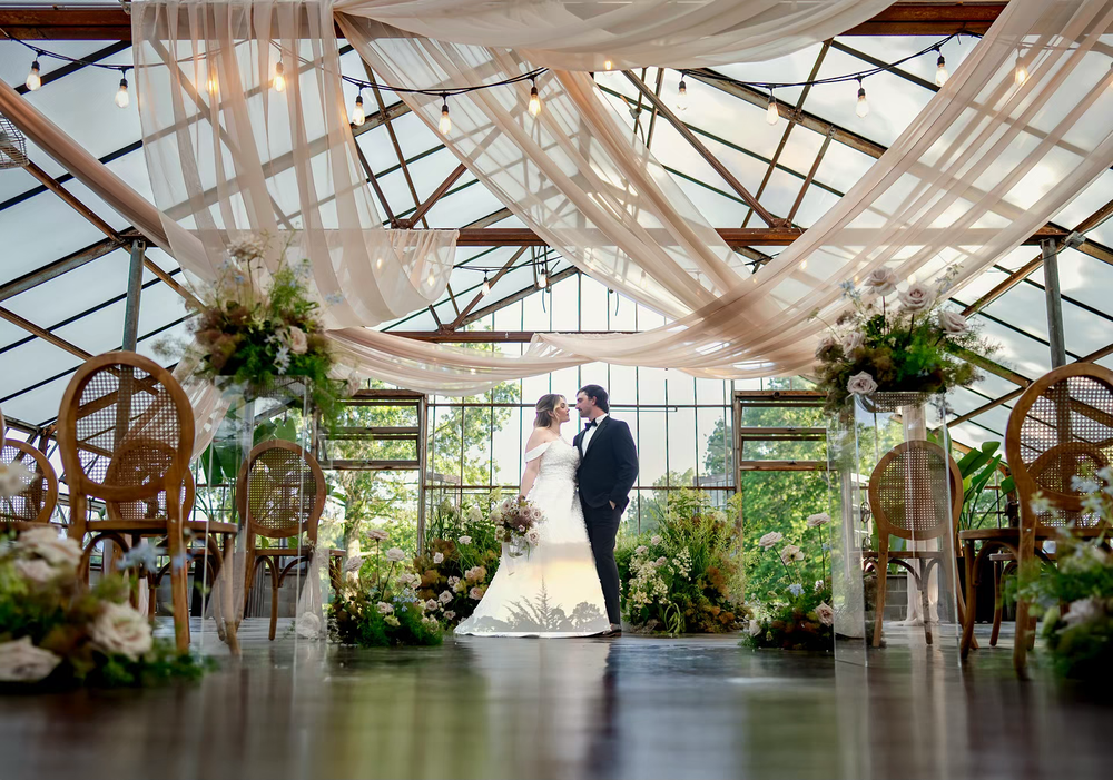 Couple shares romantic moment at greenhouse wedding venue in columbus ohio