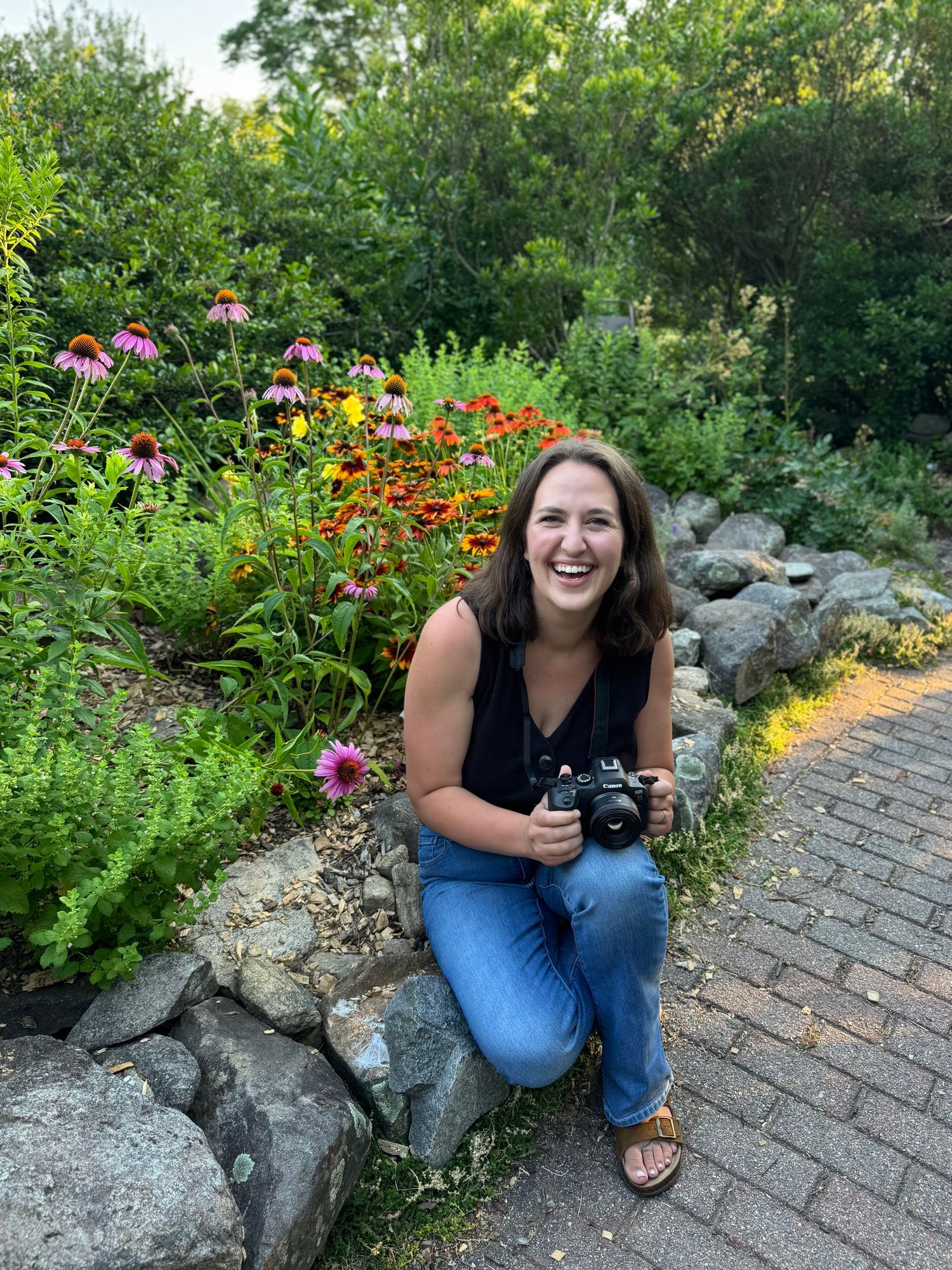 Photographer headshot next to a garden in Acton, MA