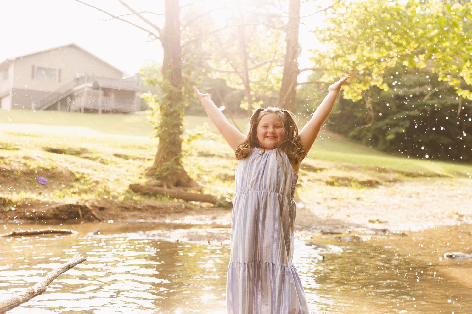 girl playing in creek during mini sessions