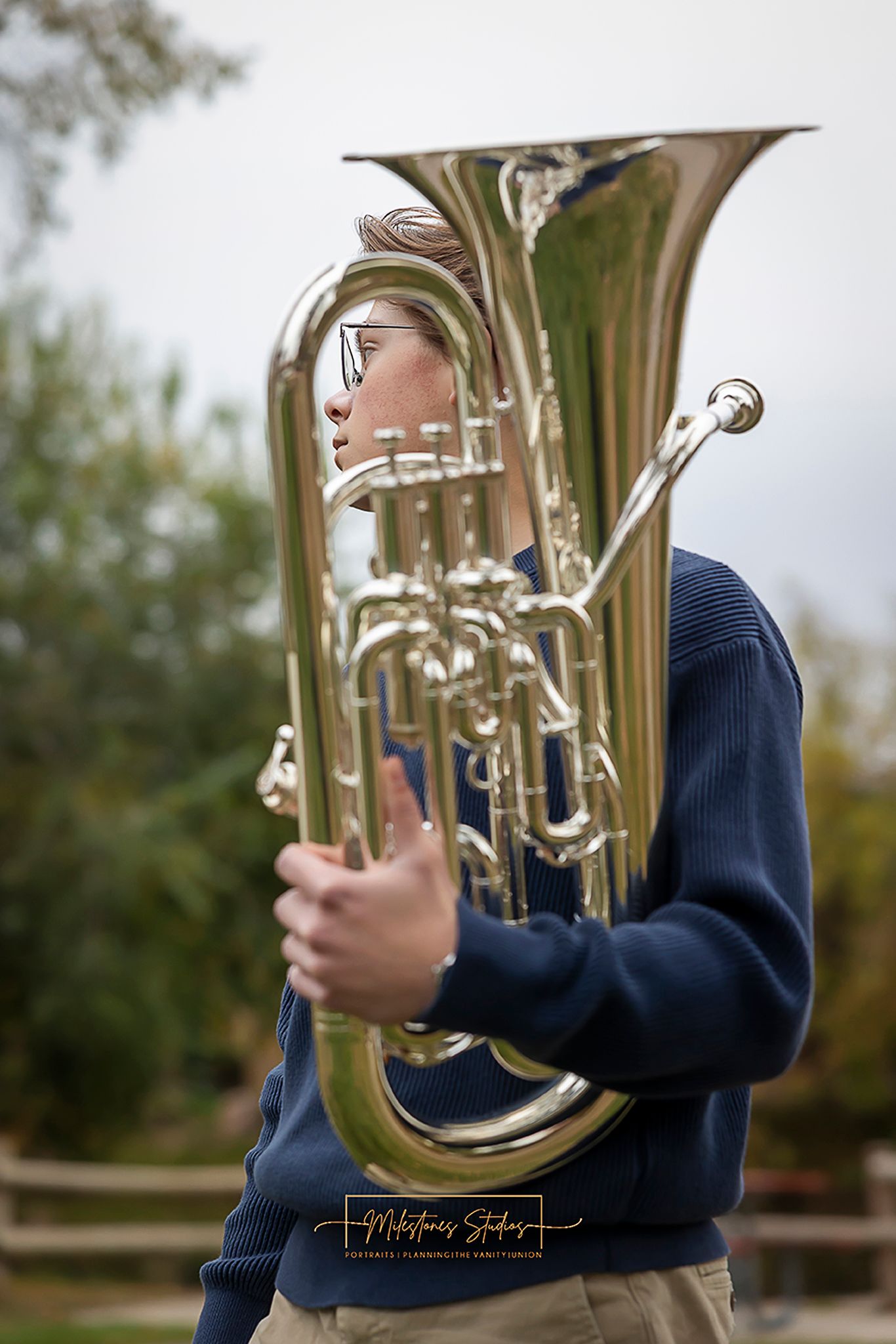 Senior portraits on the Boise River Greenbelt in Meridian, Idaho. Class of 2027 session with euphonium