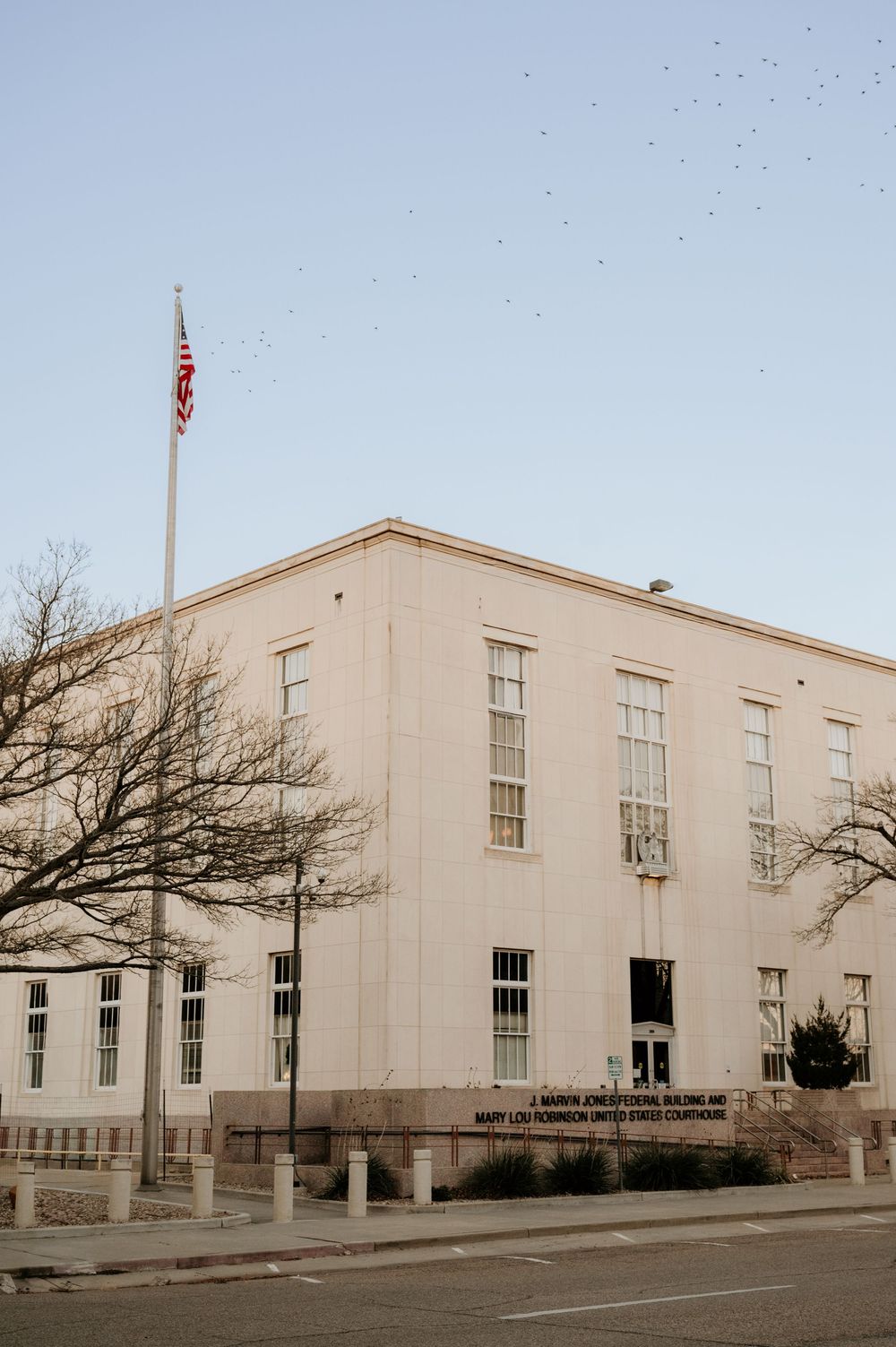 The J. Marvin Jones Federal Building and Mary Lou Robinson United States Courthouse with an American flag in Amarillo, TX.