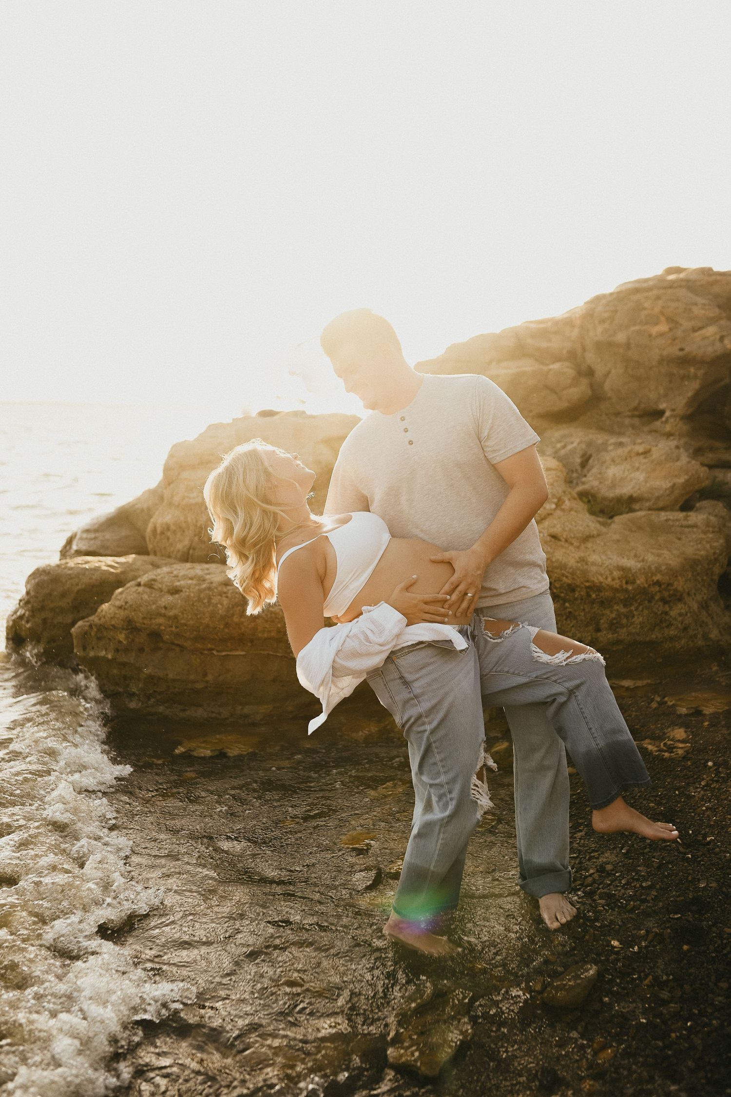 Flower Mound maternity session with expecting parents at Lake Grapevine during golden hour