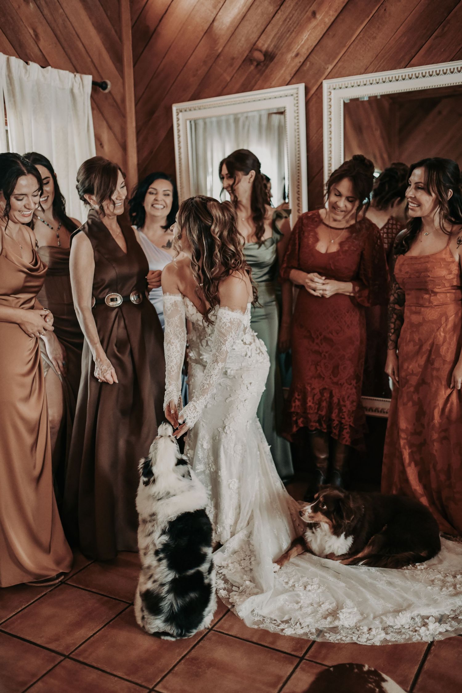 Bride getting ready with her puppies in the bridal suite at Lucky Spur Ranch