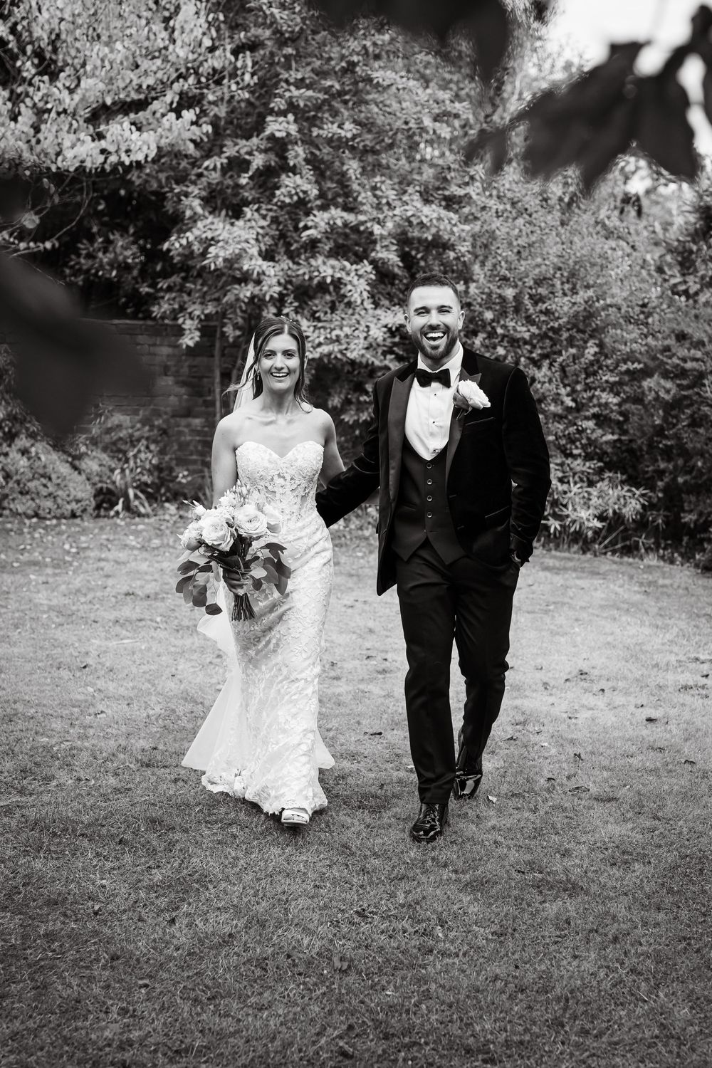 Black and white wedding portrait of newlyweds at Curradine Barns