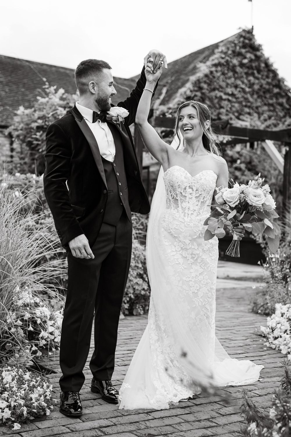 Black and white wedding portrait of newlyweds at Curradine Barns