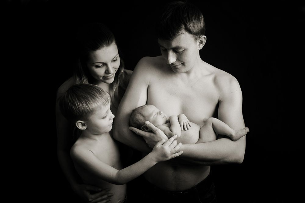 Fine art black and white family portrait with newborn photographed by Houston family photographer