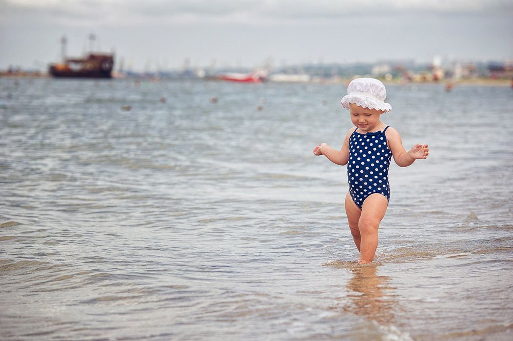 Lifestyle baby photography at the beach captured by Houston family photographer