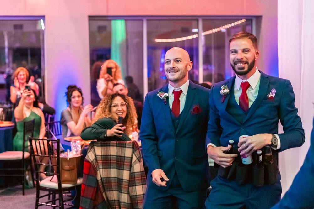 Channel Side Club in Palm Coast Florida. Wedding photography of fun wedding reception. People dancing at party.
