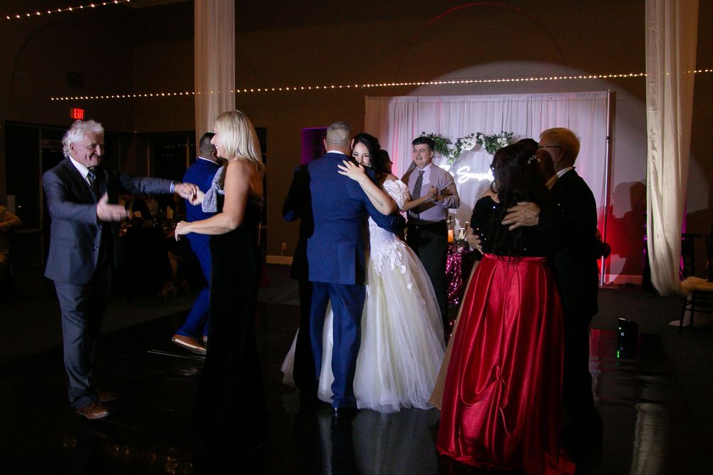 Channel Side Club in Palm Coast Florida. Wedding photography of fun wedding reception. People dancing at party.