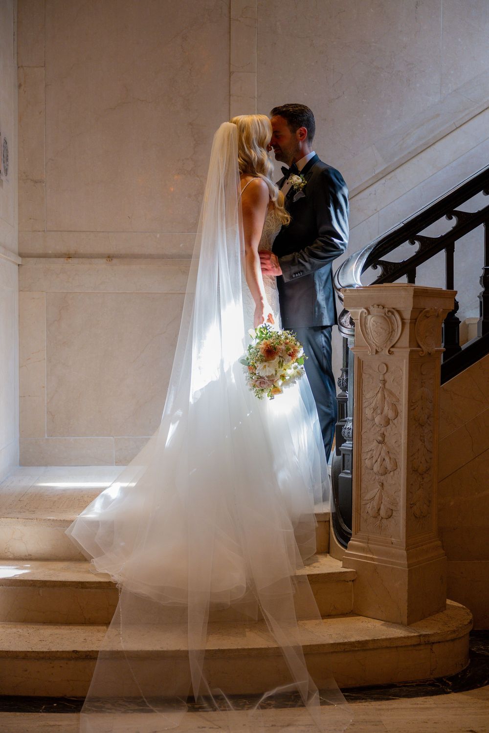 Bride and Groom in dramatic picture with light shining on them