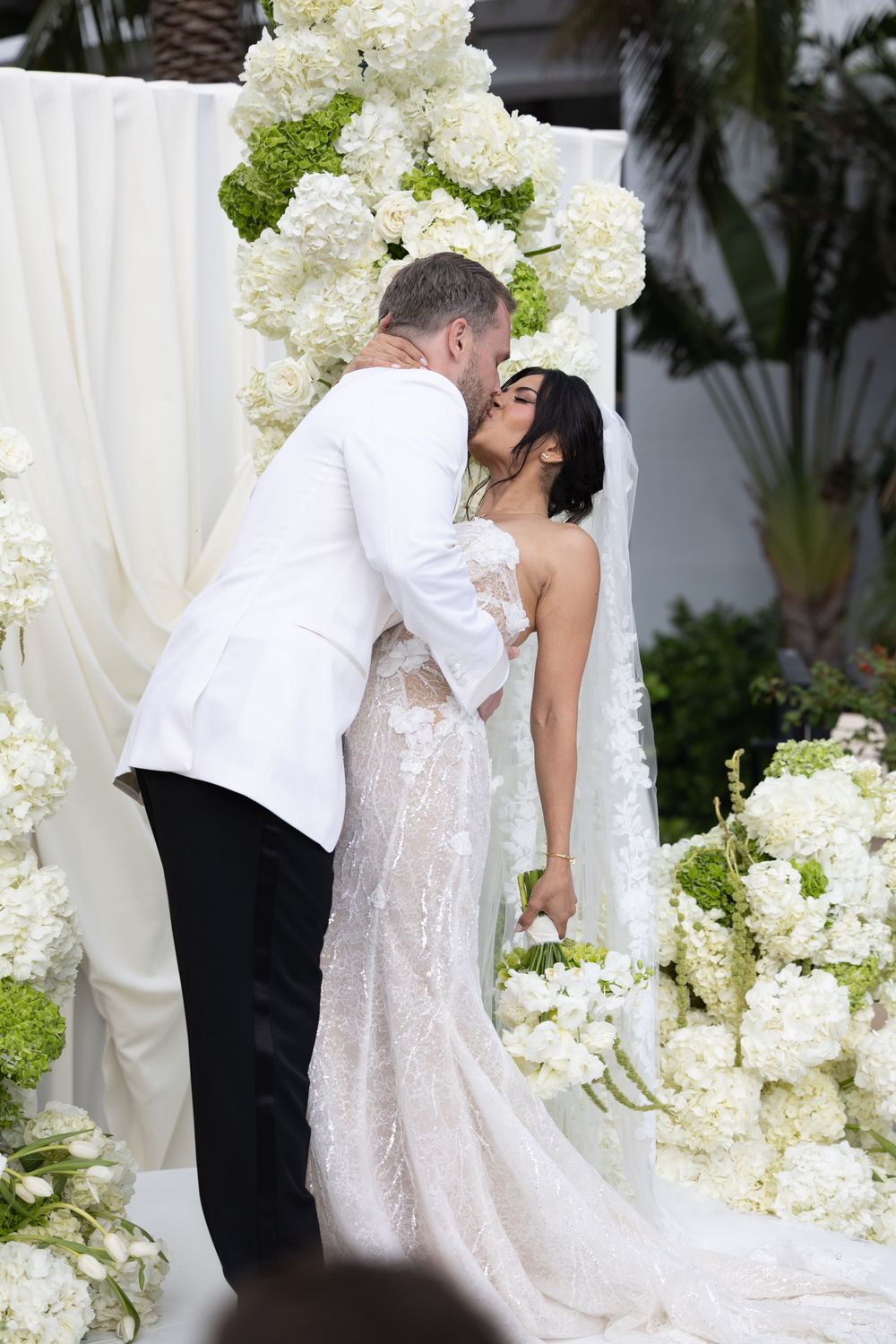 Bride and groom's first kiss at The Bath Club in Miami