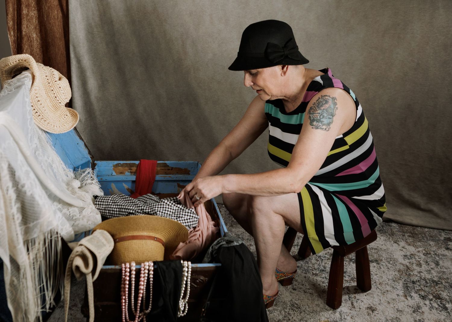 A woman takes part in a photo session featuring   vintage clothing  for dressing up with Myra Hencher near Truro, N.S.