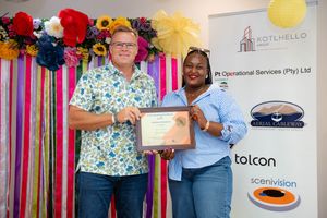 Award winners celebrating their achievement at a professionally photographed corporate event.