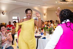 Joyful guest joining the festivities during a lively awards celebration.