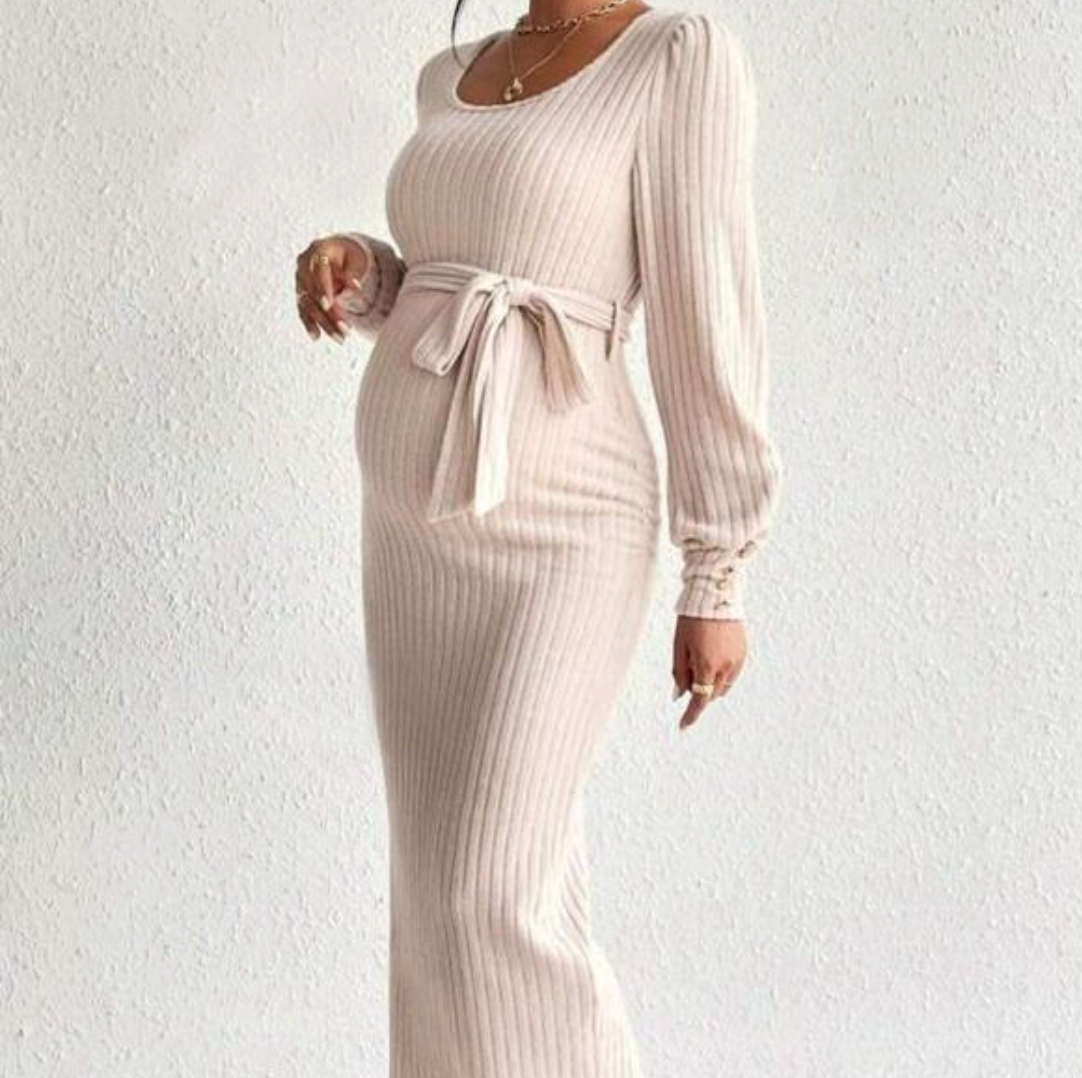 Elegant ribbed knit maxi dress in cream with long sleeves, square neckline, and tie waist belt.