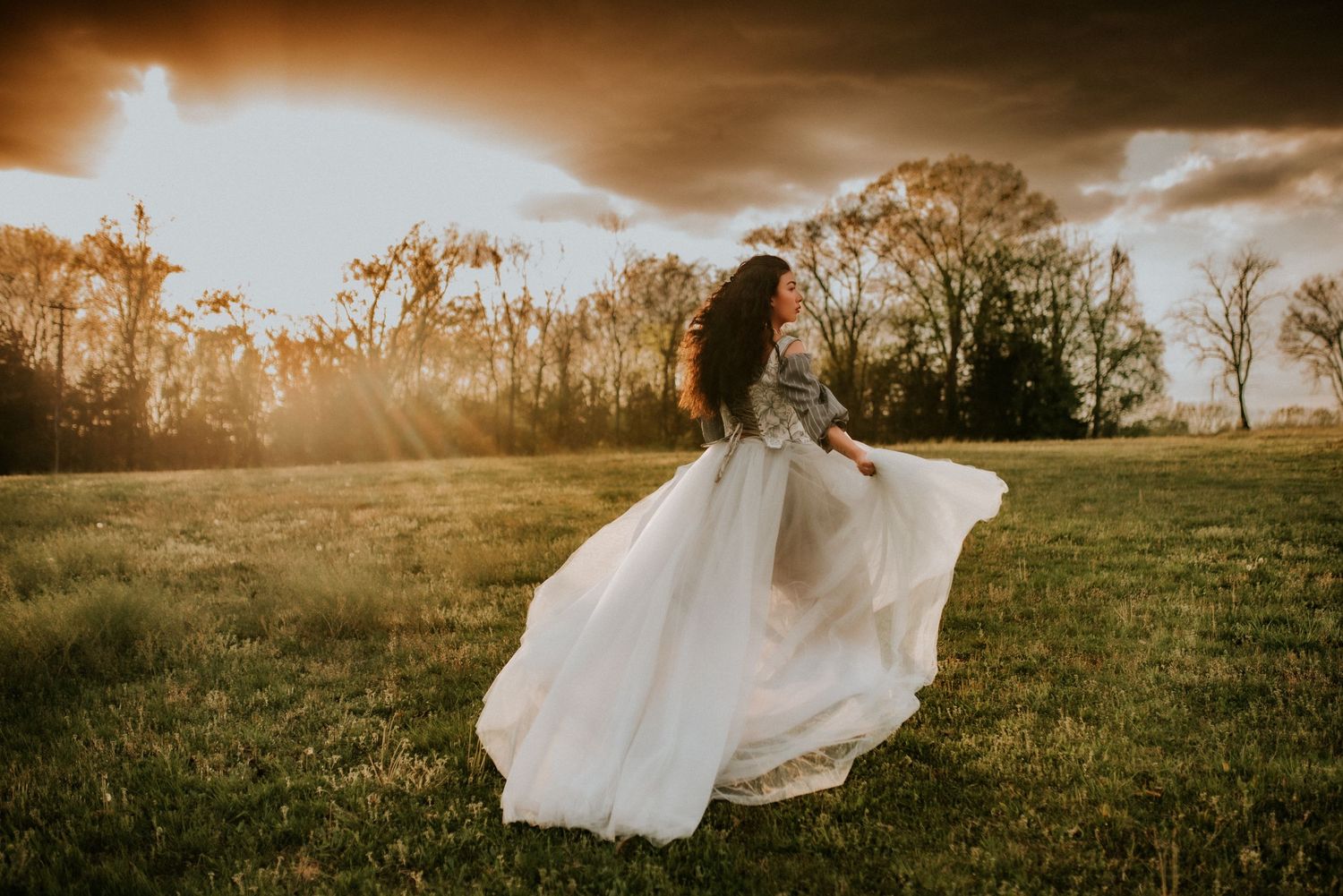 Woman in tulle dress runs into the sunset, open field, golden hour, Creative Portrait Photographer, Birthday Session, Fort Campbell, TN
