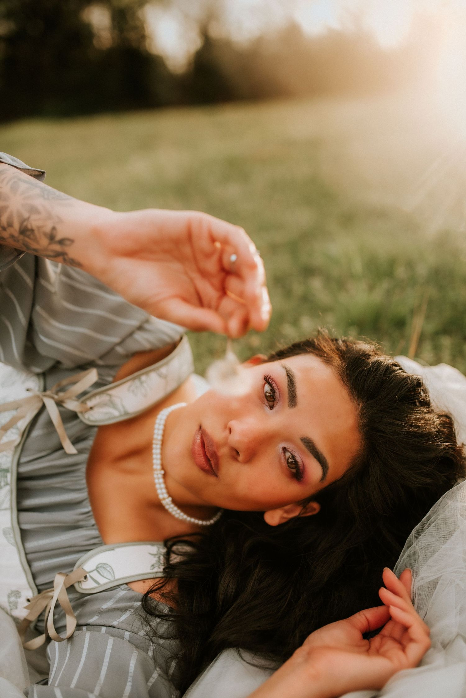Fort Campbell Photographer, Birthday Portraits, Portrait photographer, Woman laying with a dandelion in her hand, Nashville, Clarksville