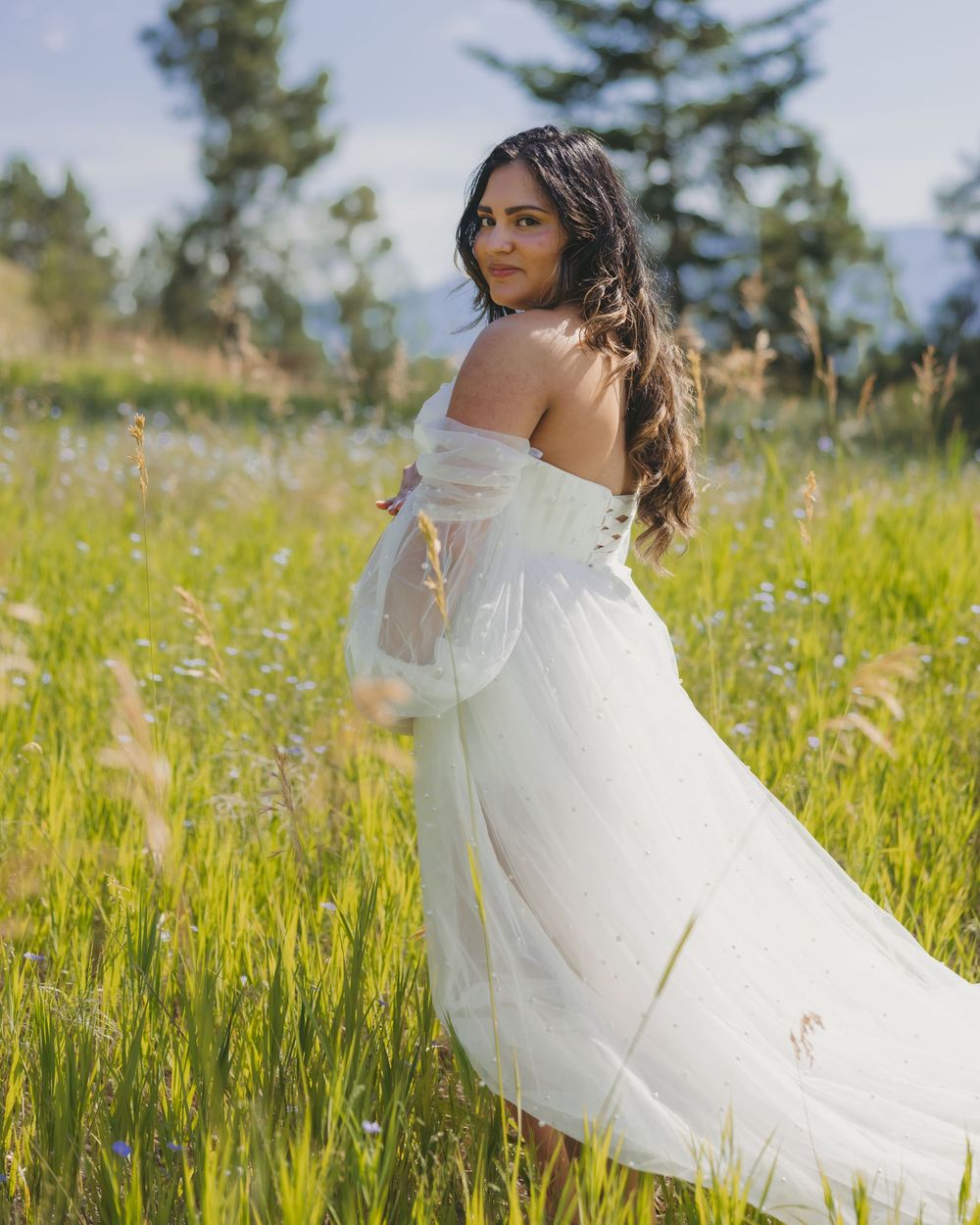 Maternity session in a wildflower meadow.