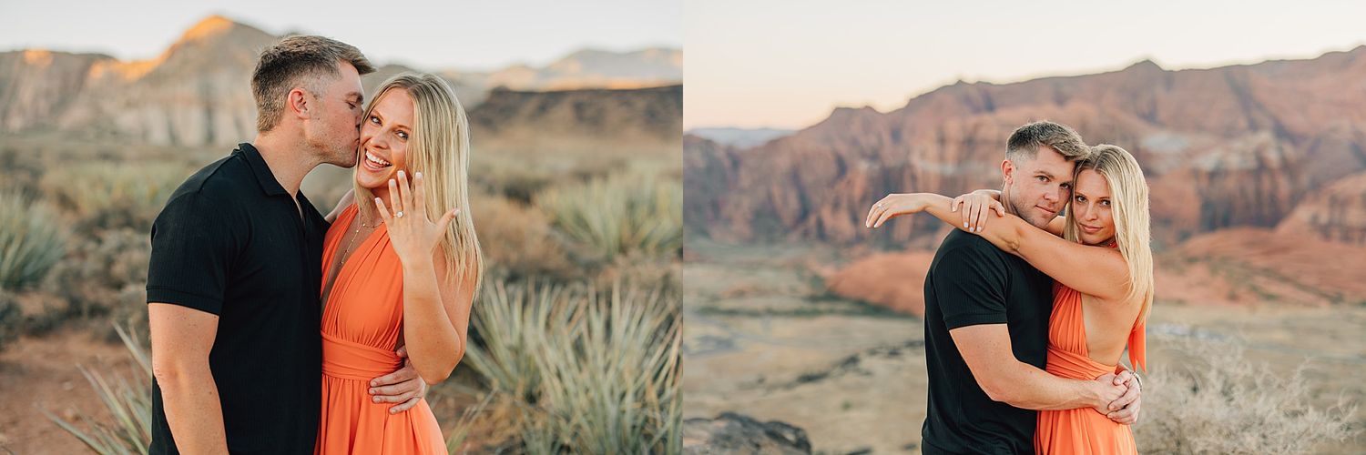 Couple embraces in desert landscape with red rock formations at golden hour, woman in orange dress.