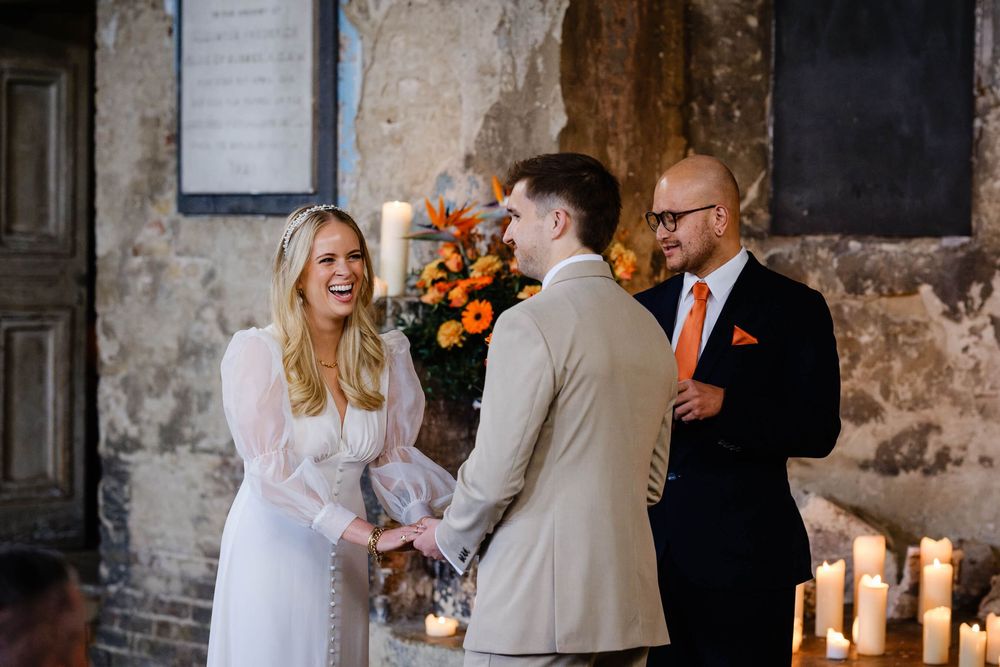 bride laughing at wedding inn the asylum chapel  London