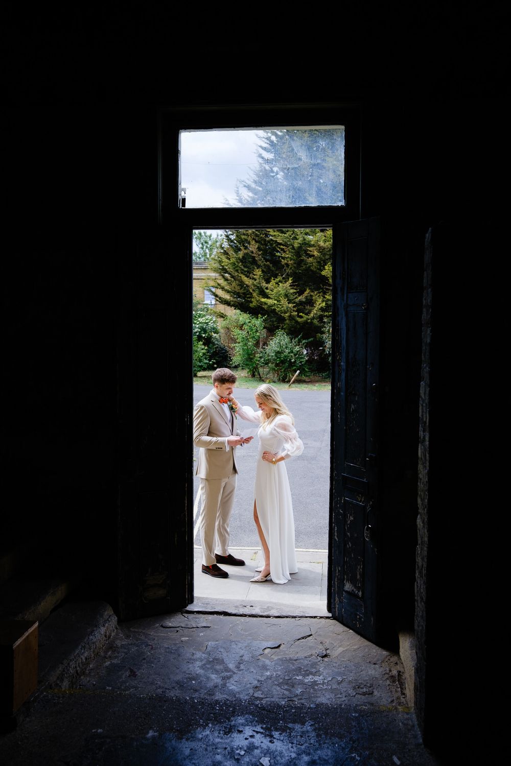 bride and groom doing private vows outside