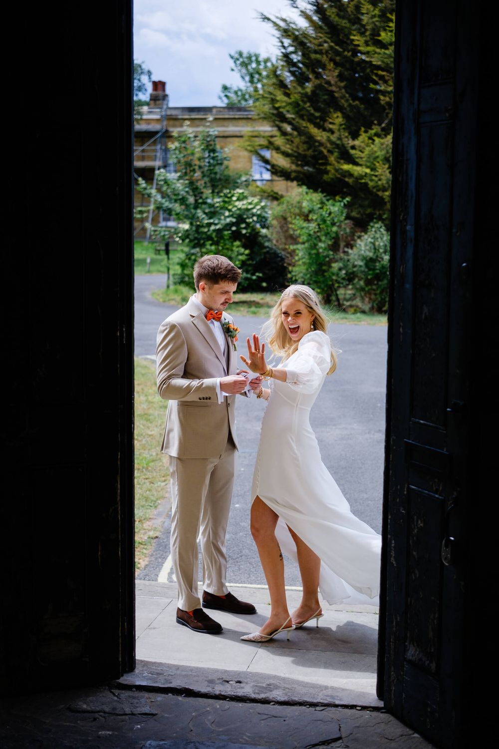 bride laughing during private vows at asylum chapel