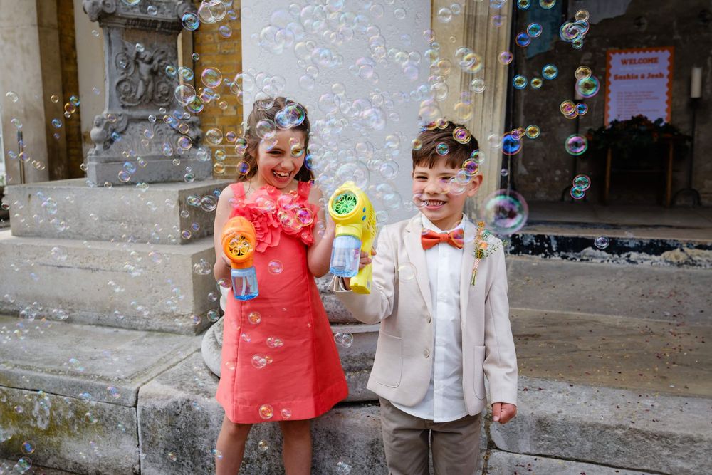 page boy with a bubble gun at the asylum chapel in London