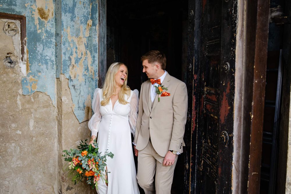 bride and groom walking out of the wedding chapel