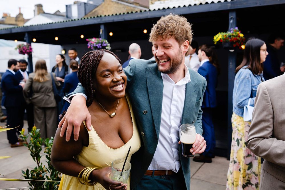 wedding guests having fun at London wedding in Lordship pub