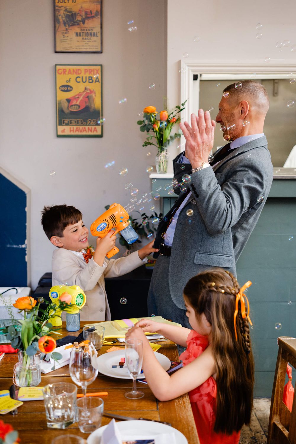 page boy with bubble gun at wedding in Lordship pub London
