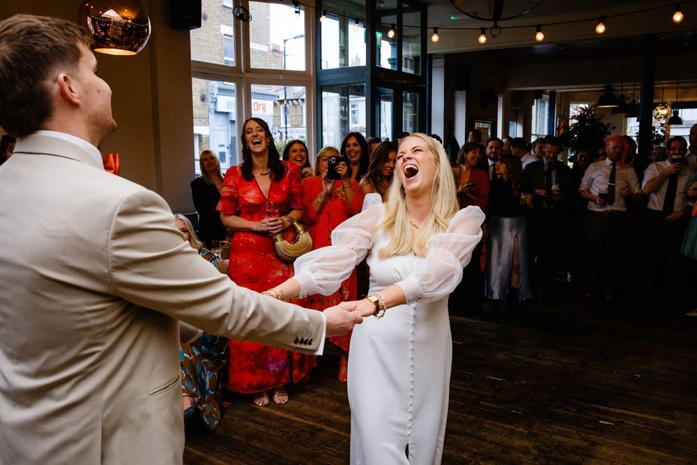 bride and groom dancing the first dance in a pub called Lordship pub in East Dulwich