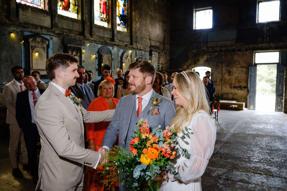 brides brother walking her down aisle
