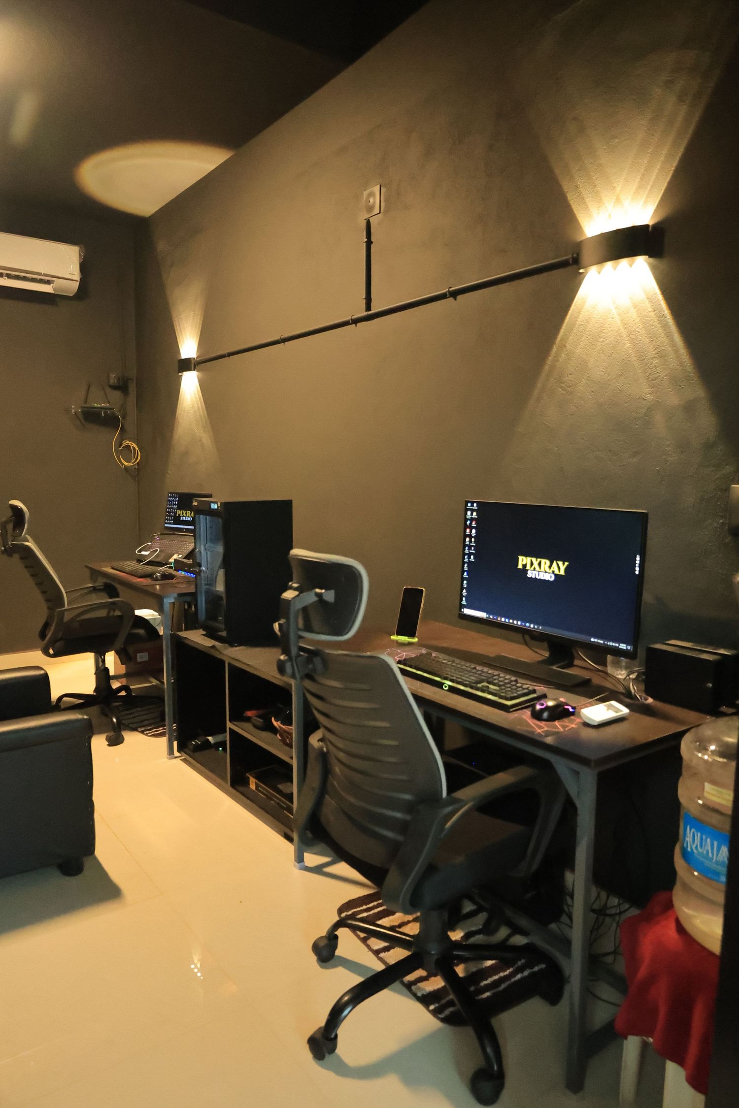 Photography editing workstation with computer monitors and editing equipment