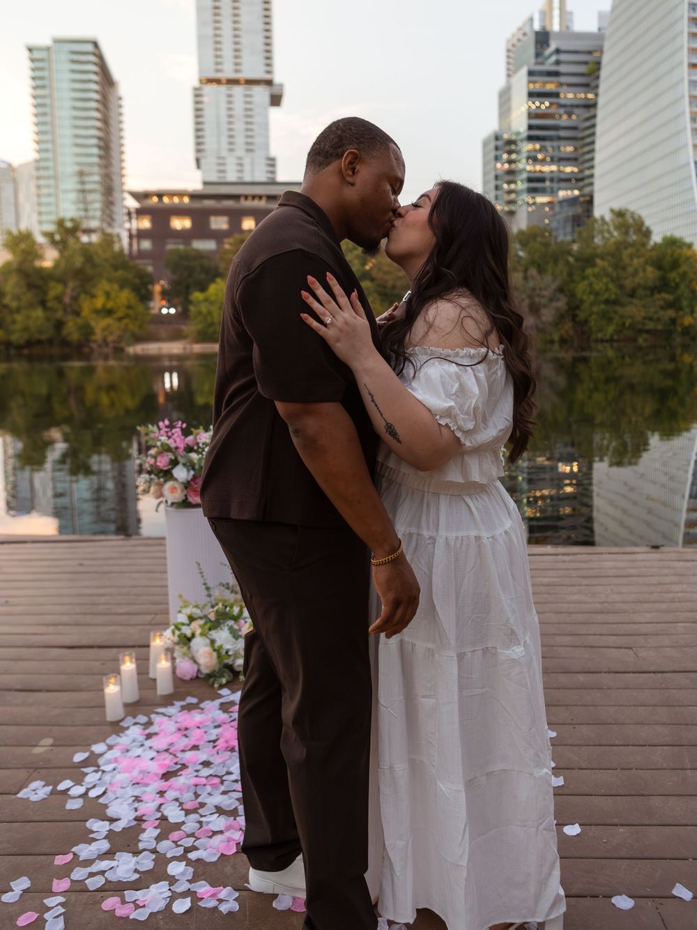 Couple kissing each other during proposal at Butler Metro Park.