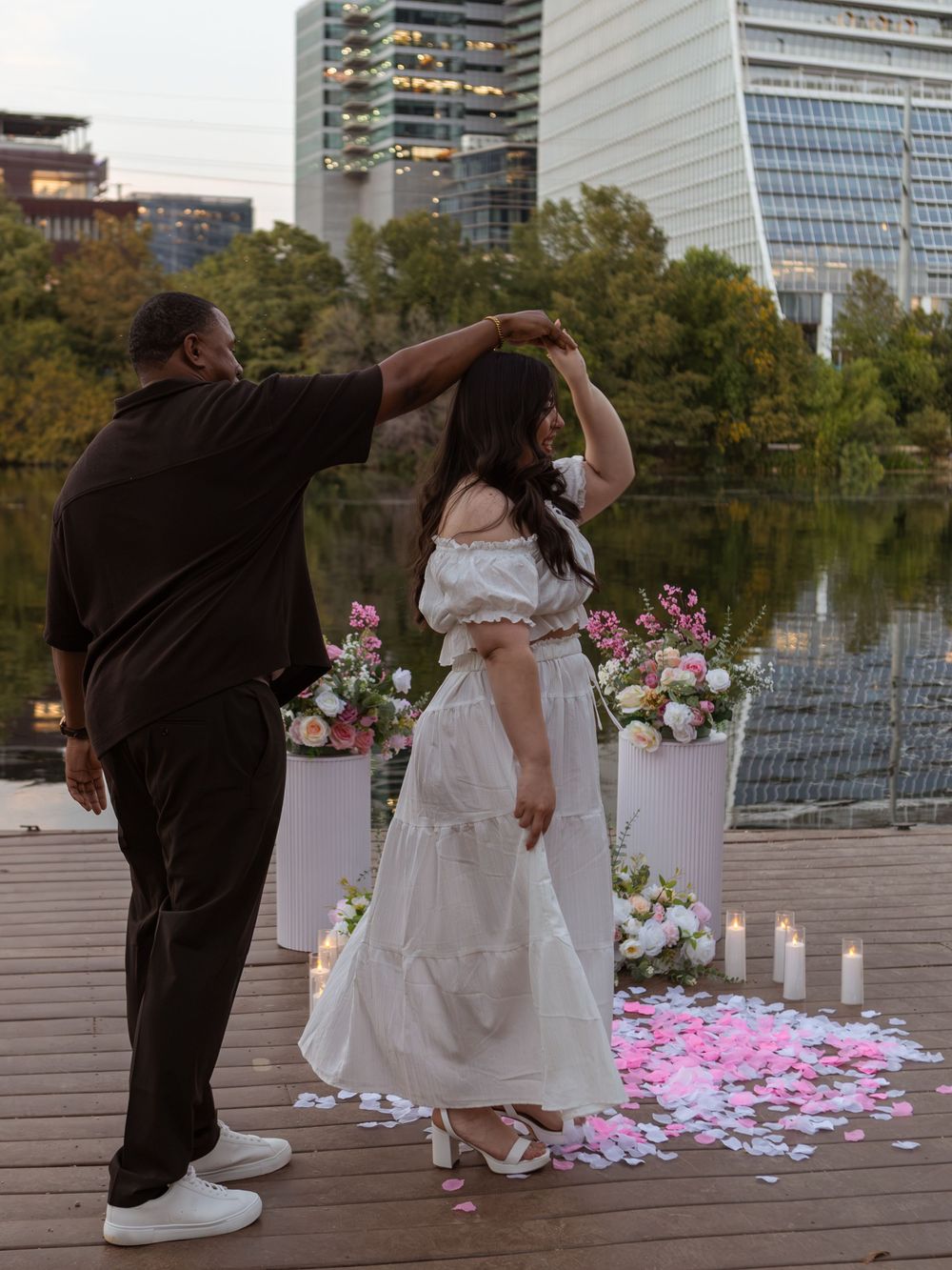 Couple dancing during propsal at butler metro park.