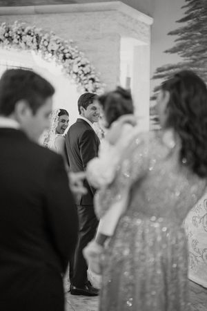 Multiple frames capture intimate moments during a wedding celebration with bubbles floating in the air.