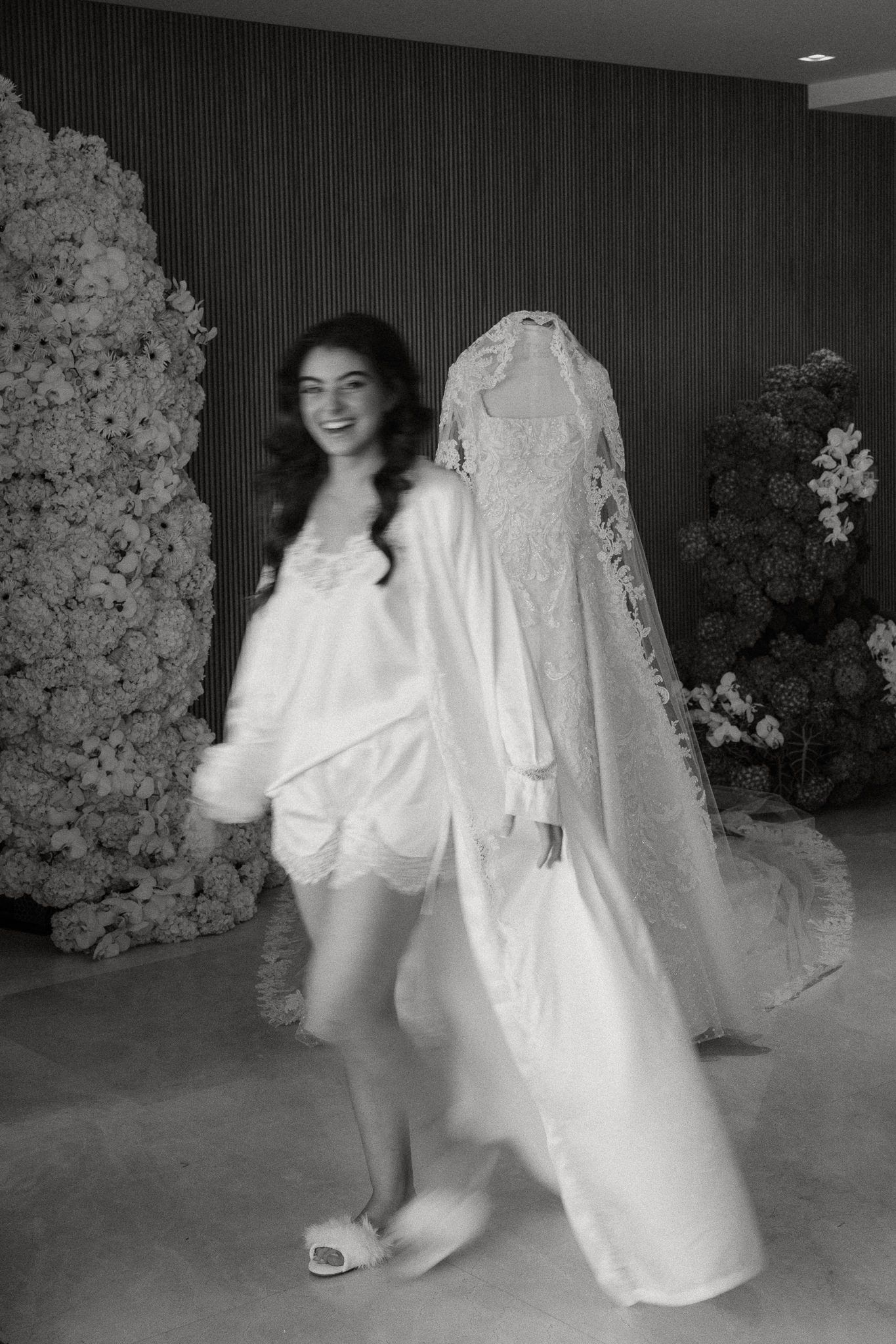 Artistic black and white photos show someone dancing in a flowing white dress against a dark background.