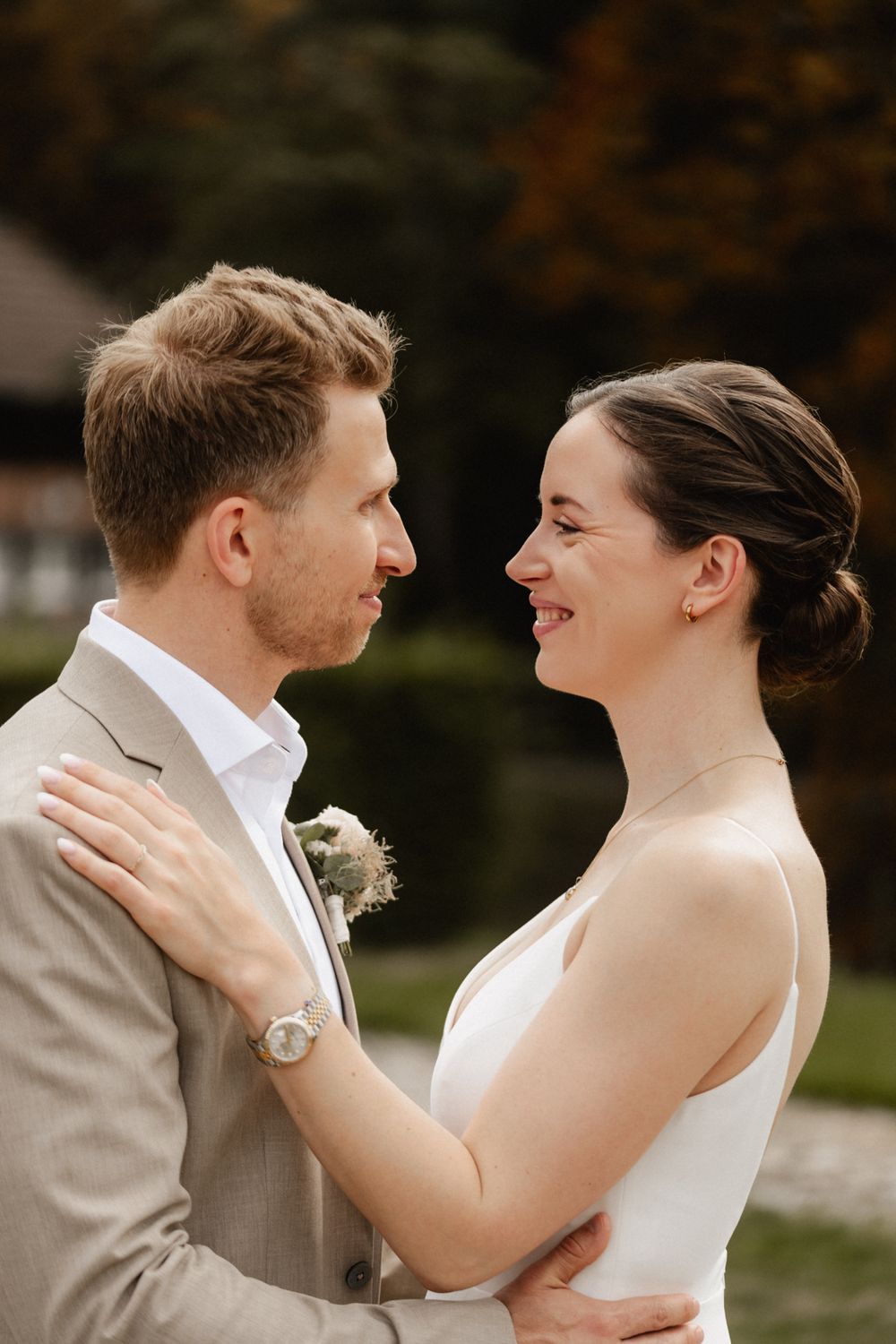 A romantic sequence of wedding photos showing a couple embracing and laughing together outdoors.