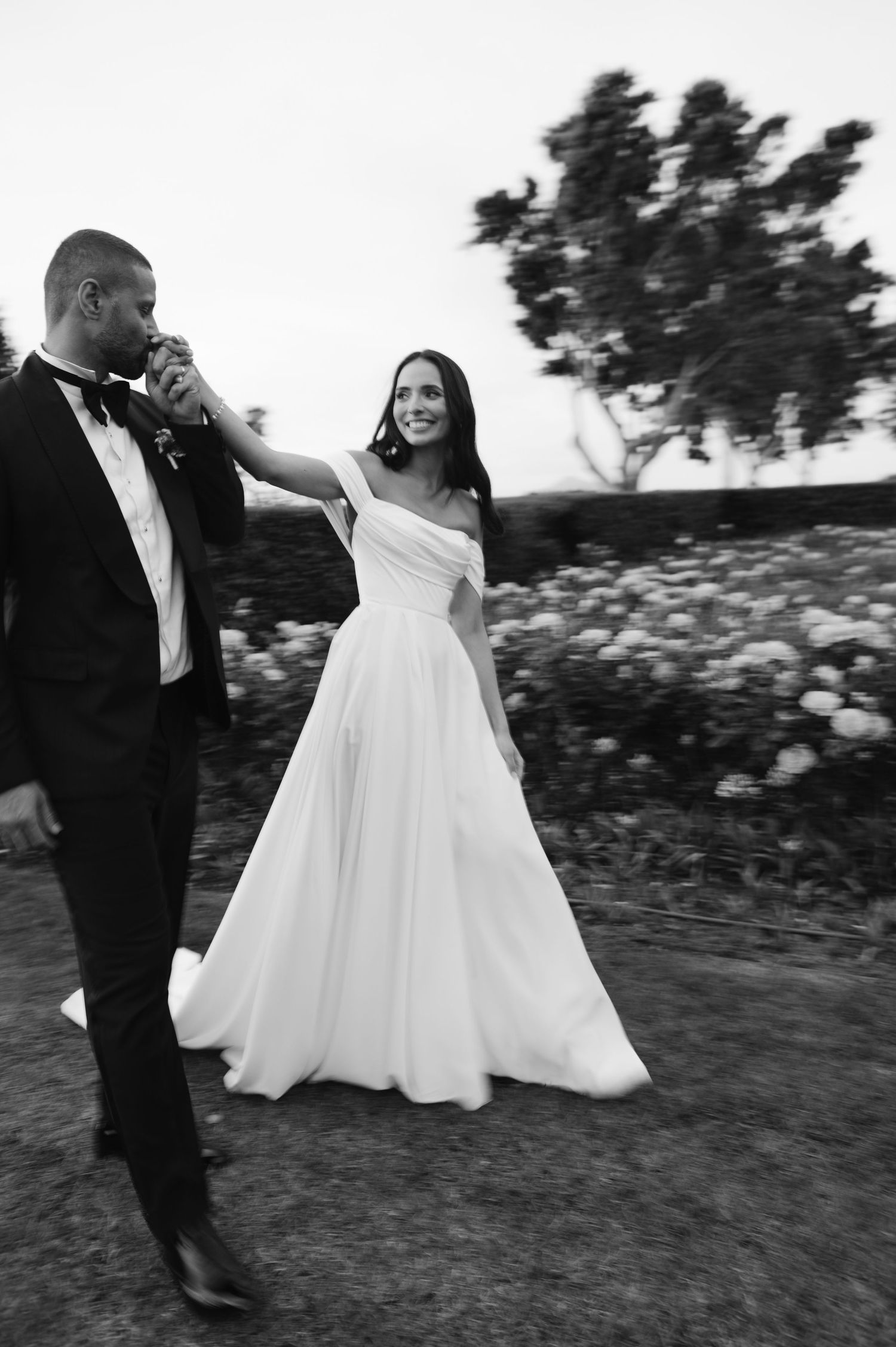 A black and white photo sequence shows a couple dancing outdoors in formal wedding attire.