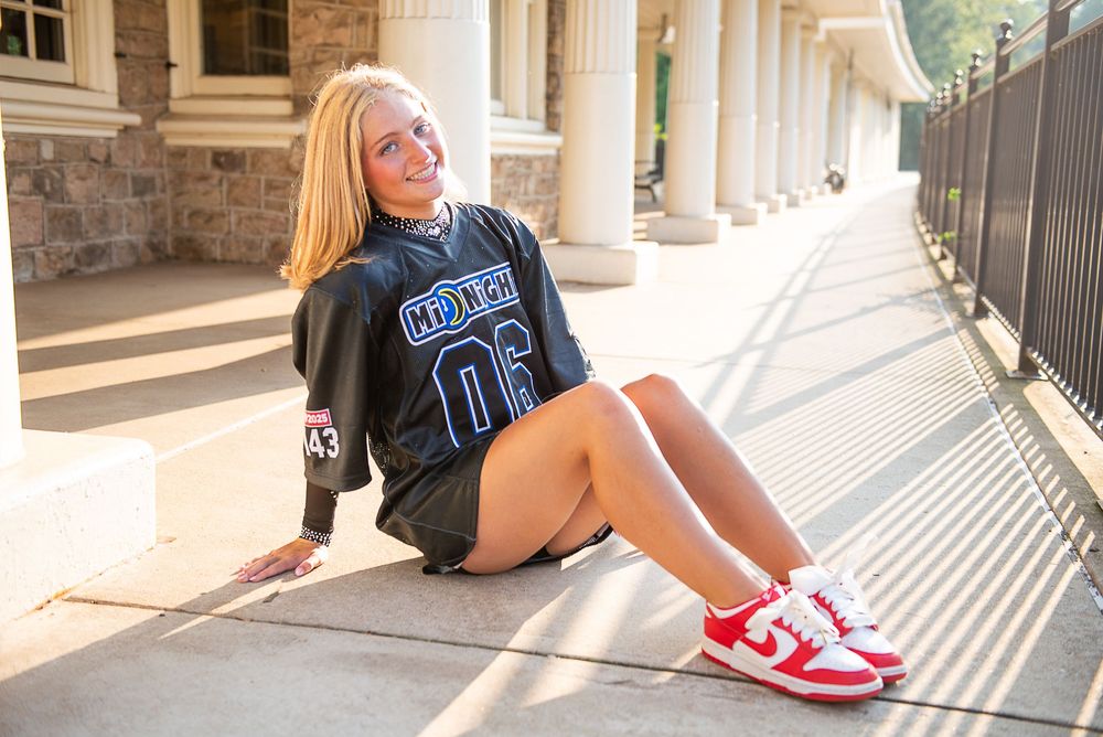 Fashion portraits captured along an elegant columned walkway with natural lighting and architectural details.