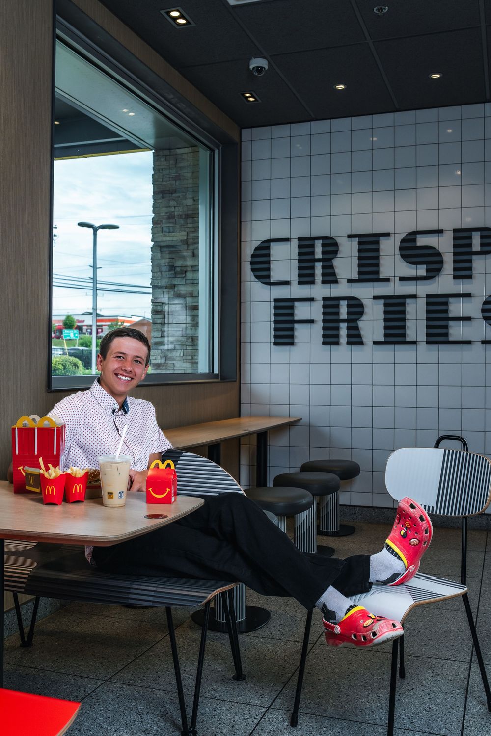 A sequence of photos showing McDonald's food and drinks being placed on tables in a modern office break room.