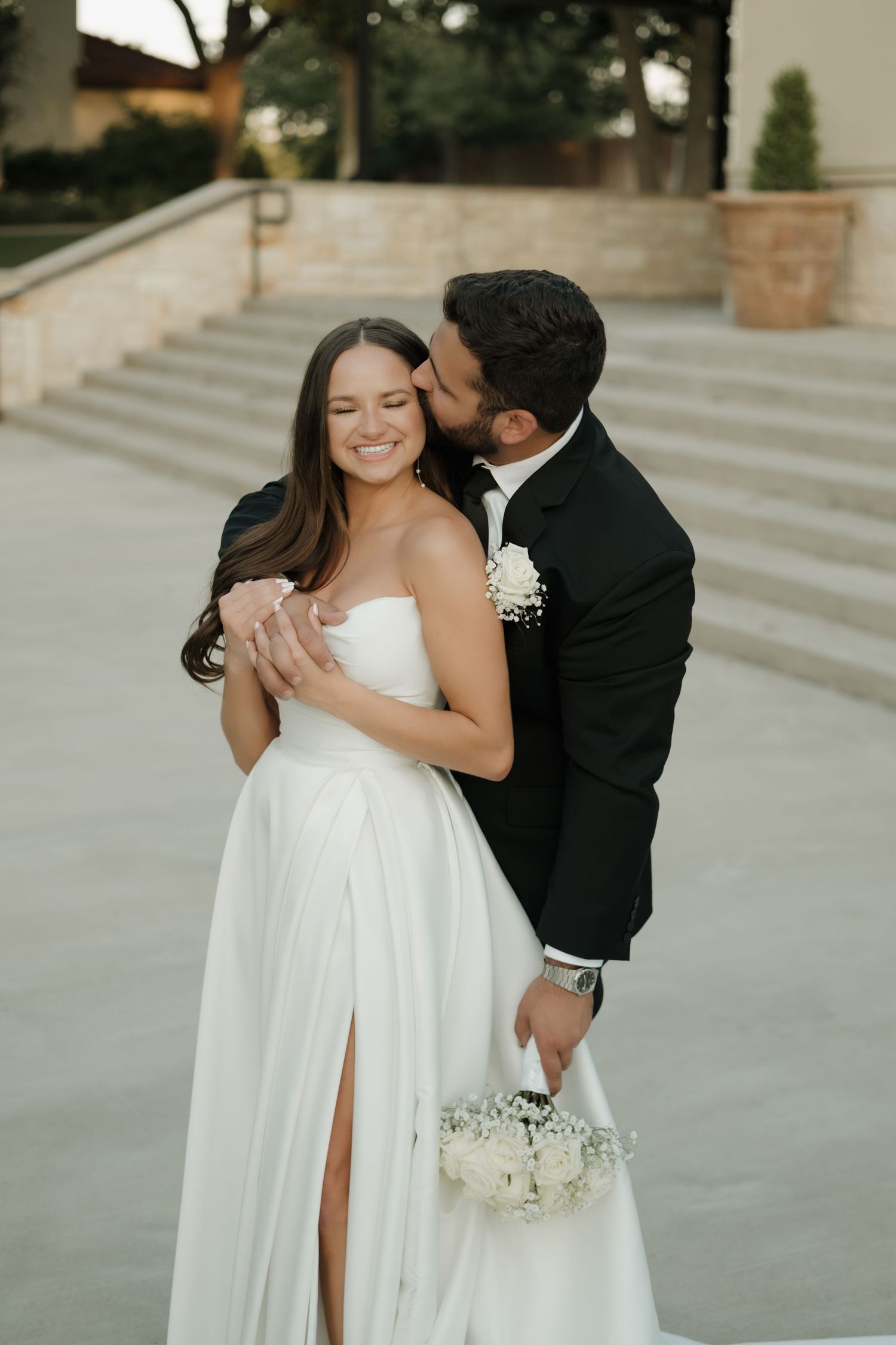 A romantic wedding moment captured in a series of photos showing a couple in formal attire embracing on stone steps.