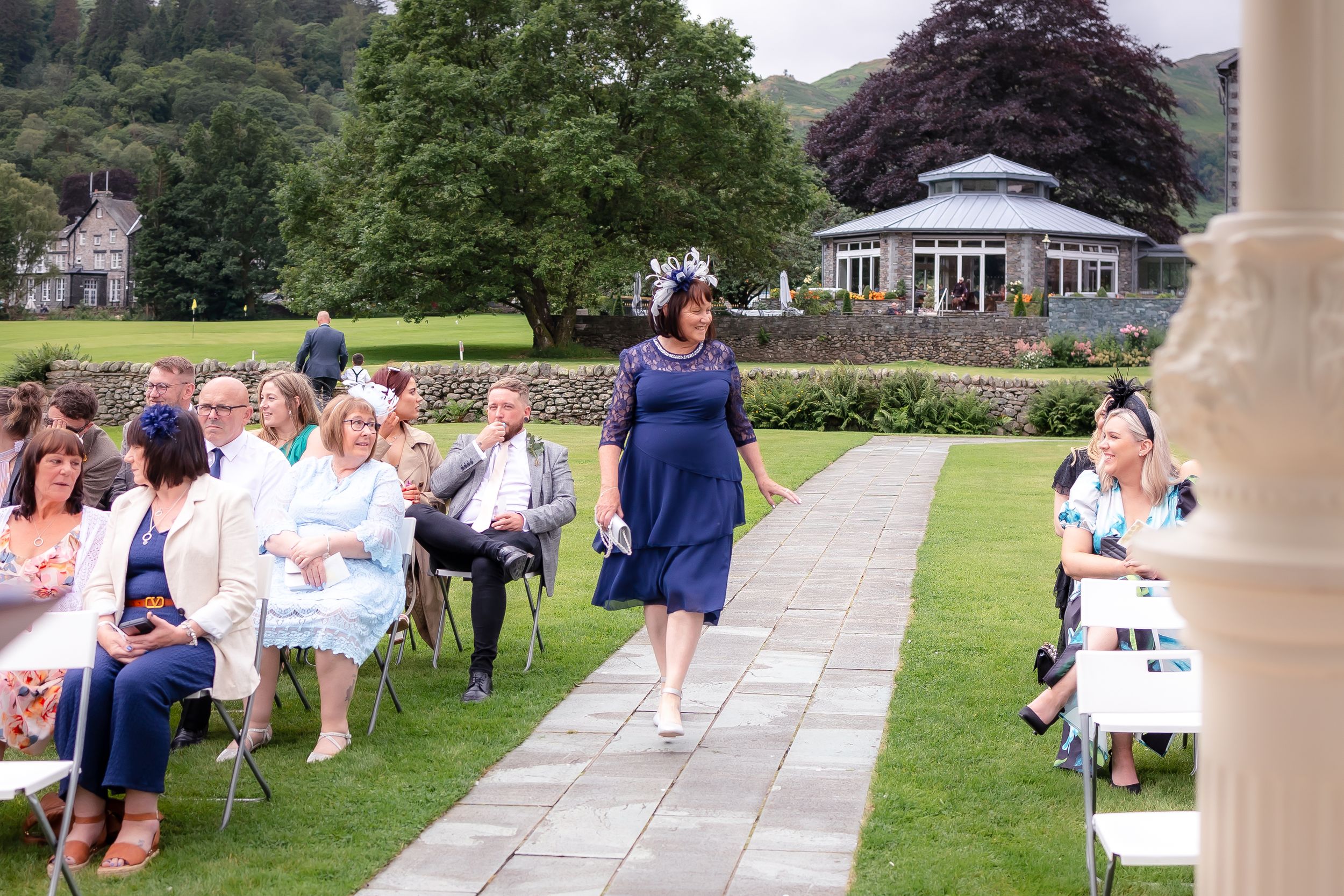 wedding photography in Cumbria - mother of the bride walking the aisle