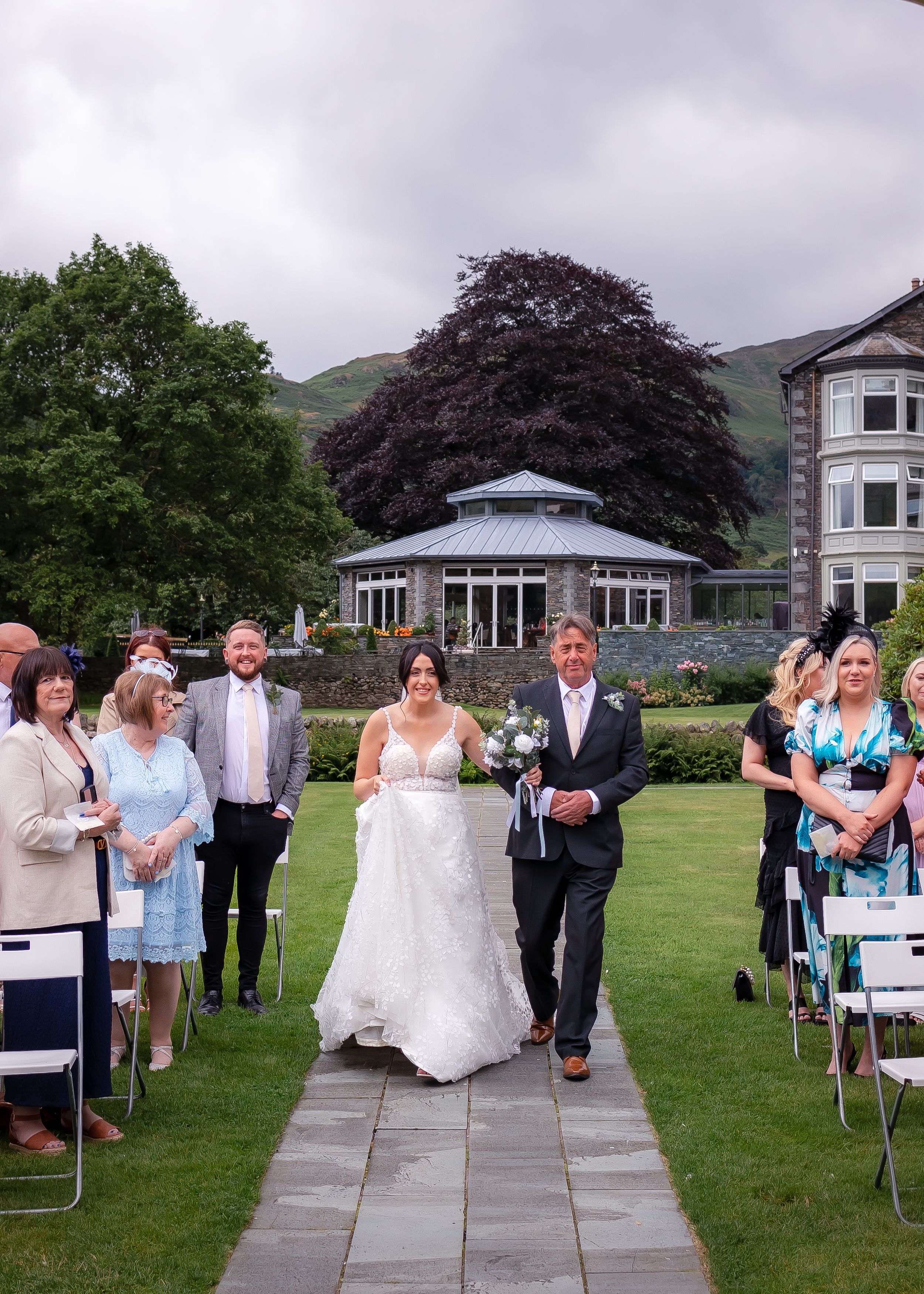 wedding photography in Cumbria - bride walking the aisle with father
