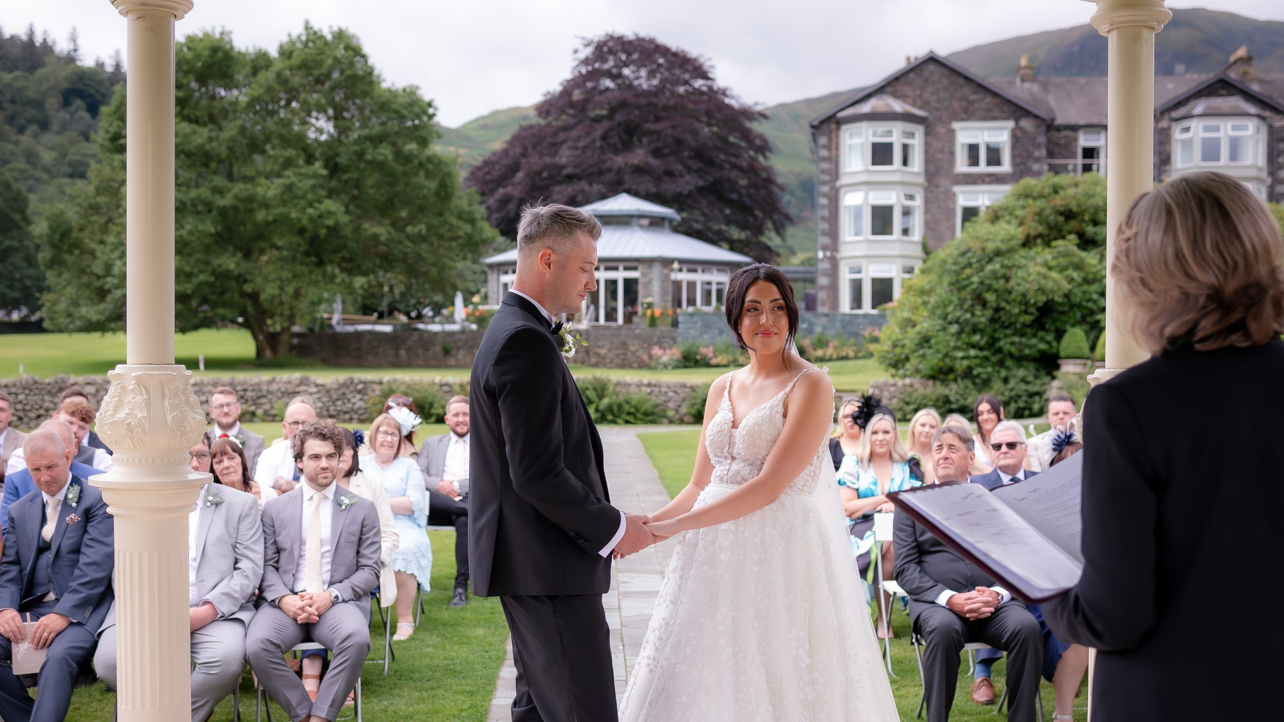 wedding photography in Cumbria - bride and groom reading vows