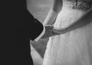 wedding photography in Cumbria - bride and groom holding hands