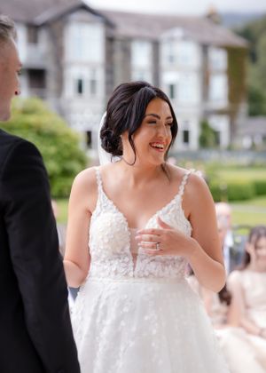 wedding photography in Cumbria - bride laughing through the ceremony