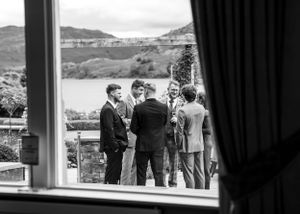wedding photography in Cumbria - guest having a drink