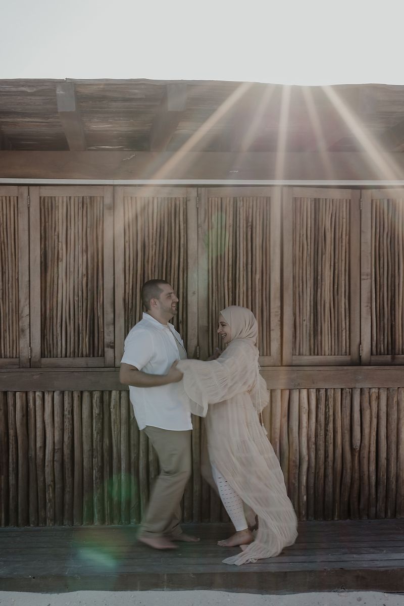 Pregnancy photo holding ultrasound at St. Regis Kanai Riviera Maya.