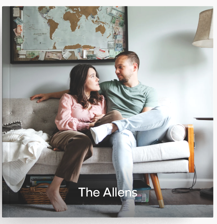 Cover of a custom photo book titled 'The Allens,' featuring a couple sitting closely on a light-colored couch beneath a map display